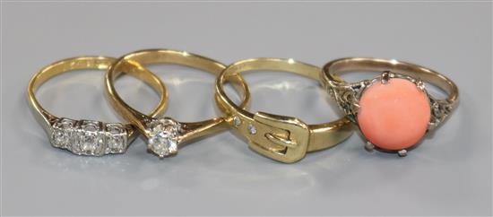 An 18ct gold and three stone diamond ring and three gem set rings including two 9ct.